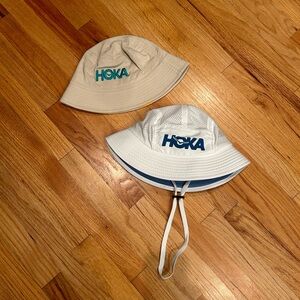 Two Hoka bucket hats
